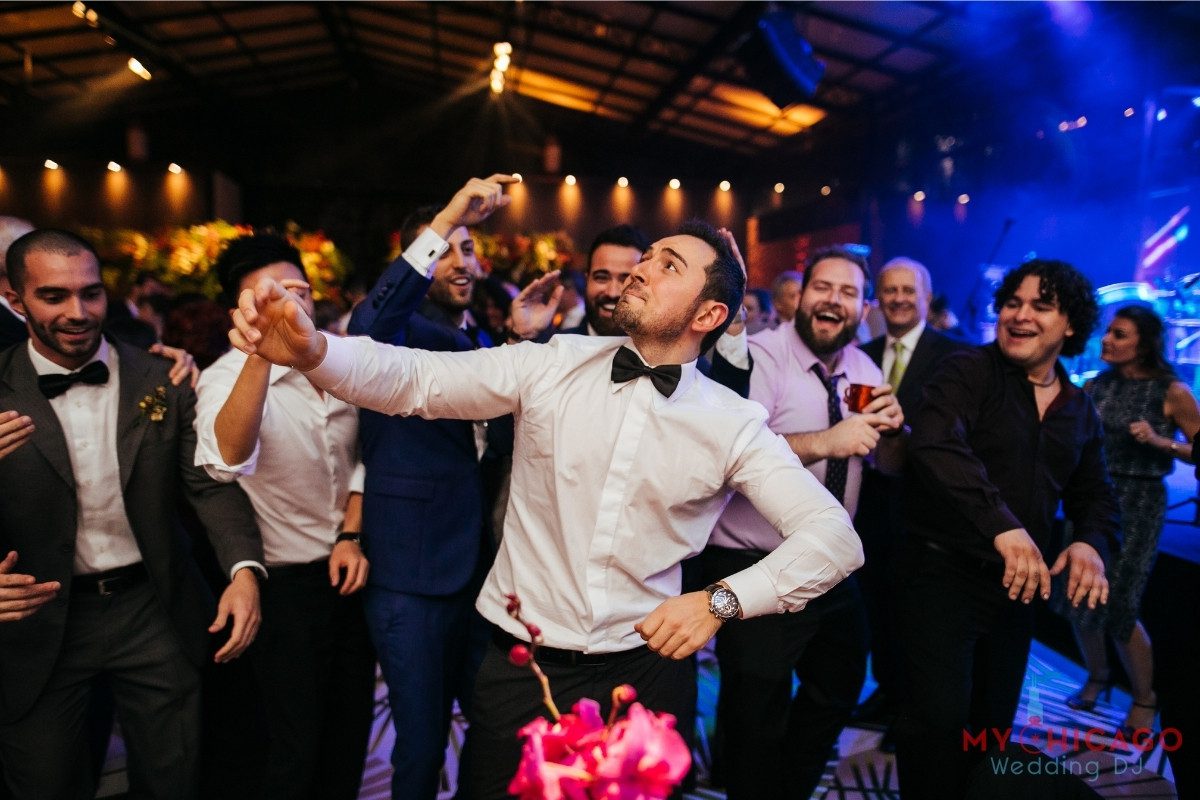 Wedding guests dancing and DJ in action